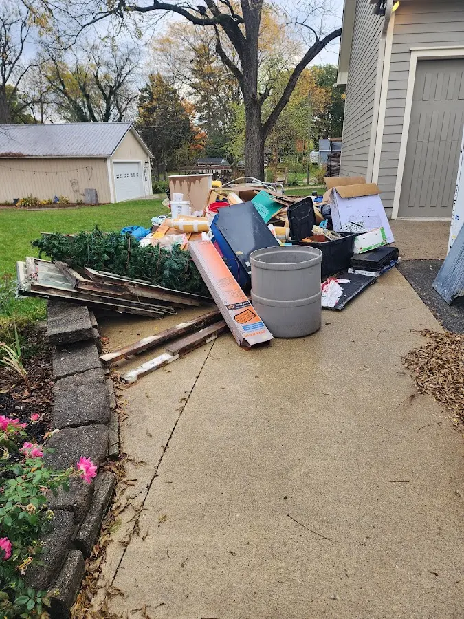Dumpster being loaded with debris for 12 Yard Dumpster Rental in Mission Viejo